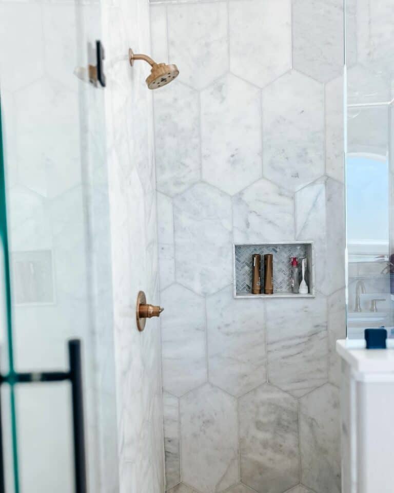 Gray Tiles and Copper Hardware in Bathroom
