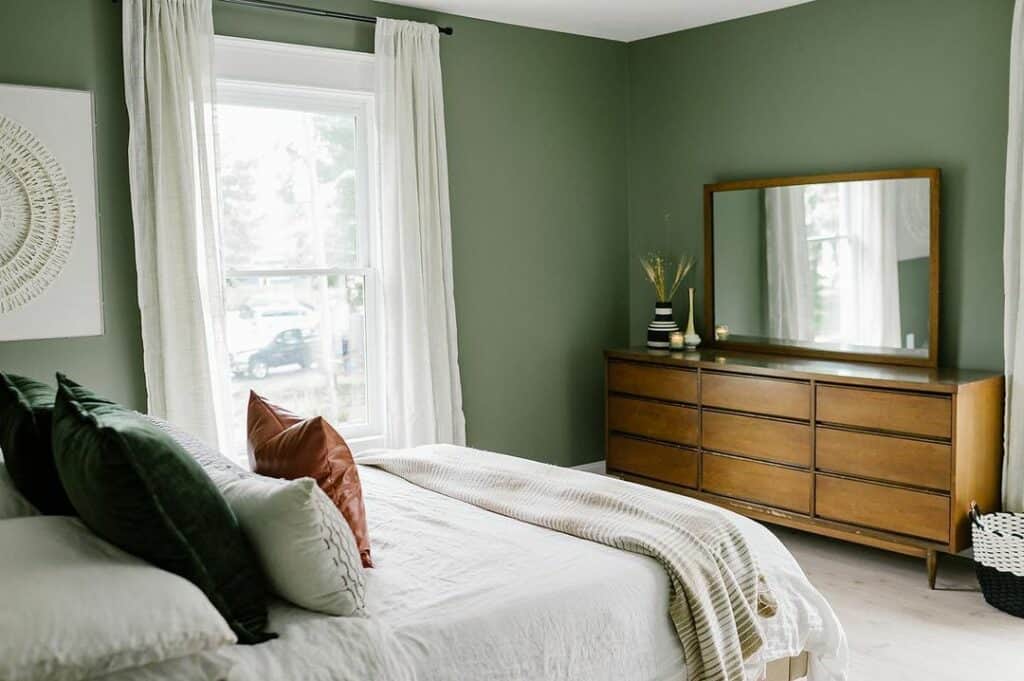 Green Bedroom With Wood Furniture