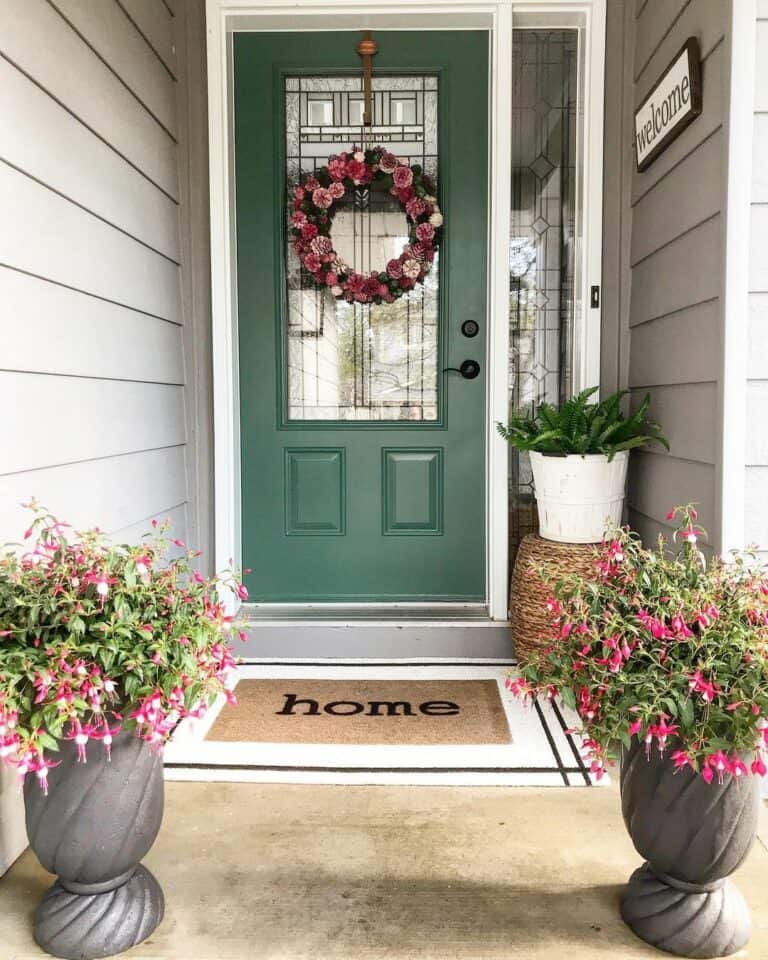 Green Home Entrance With Pink Flowers