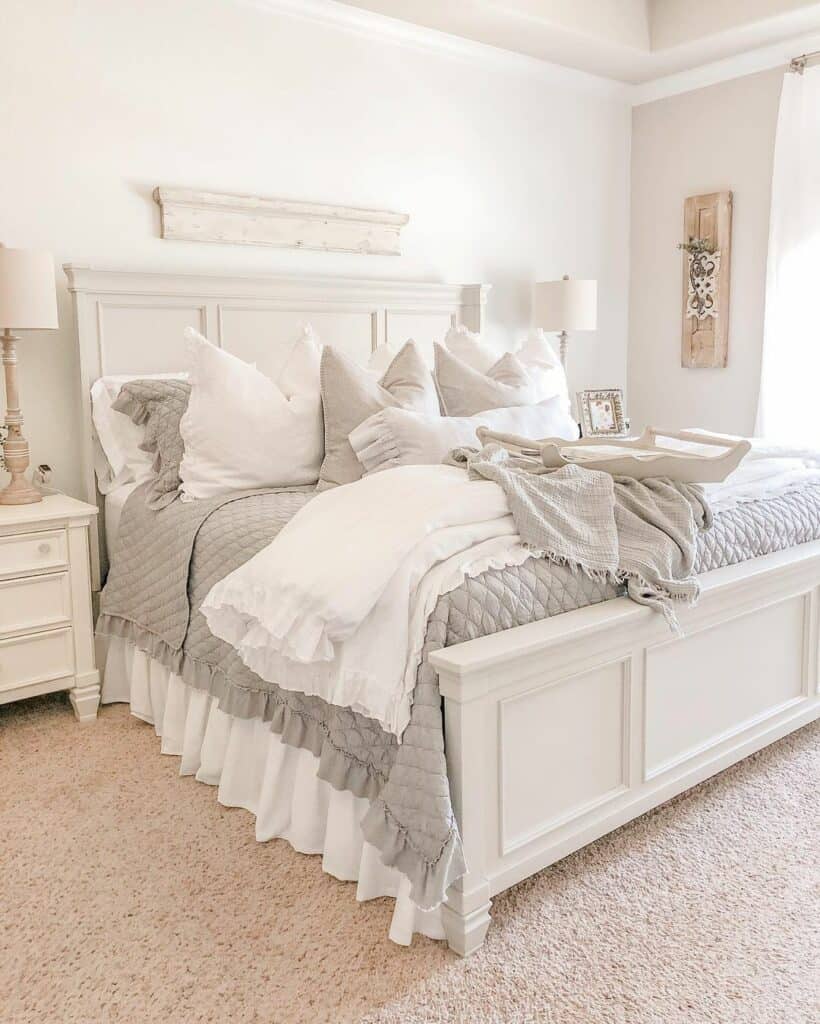 Grey and White Bedding on White Paneled Bed
