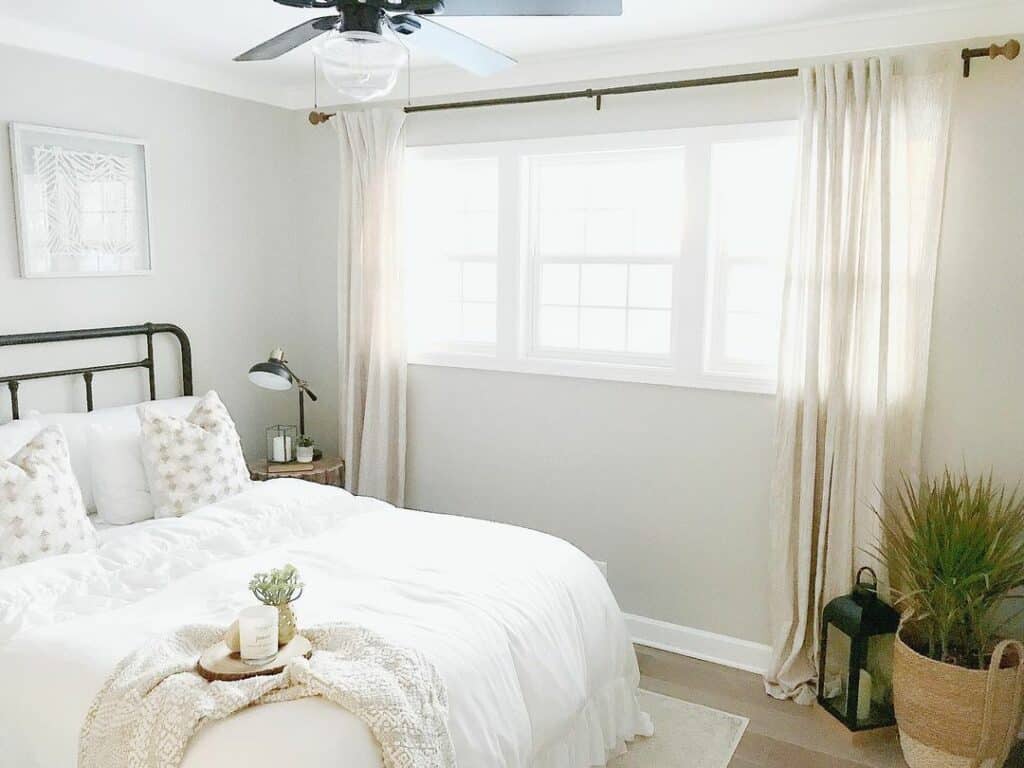Guest Bedroom With Beige Window Curtains
