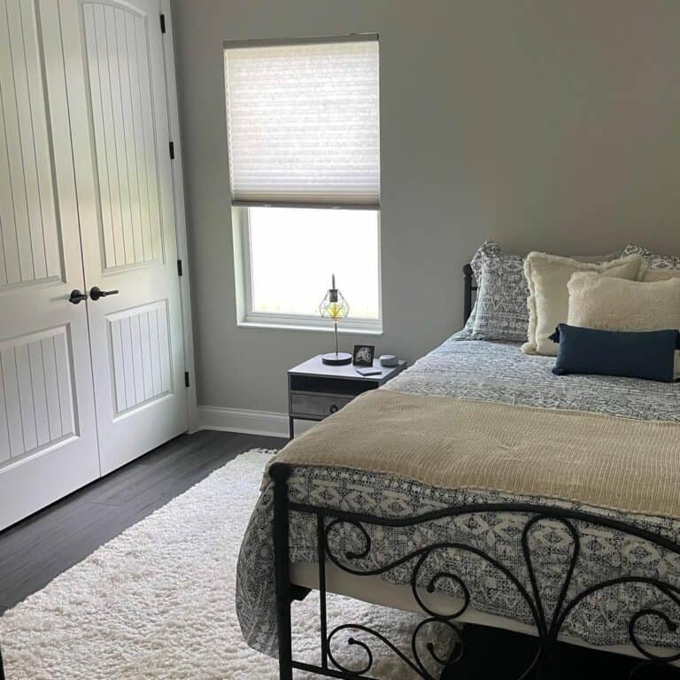 Guest Bedroom With White Double Closet Doors