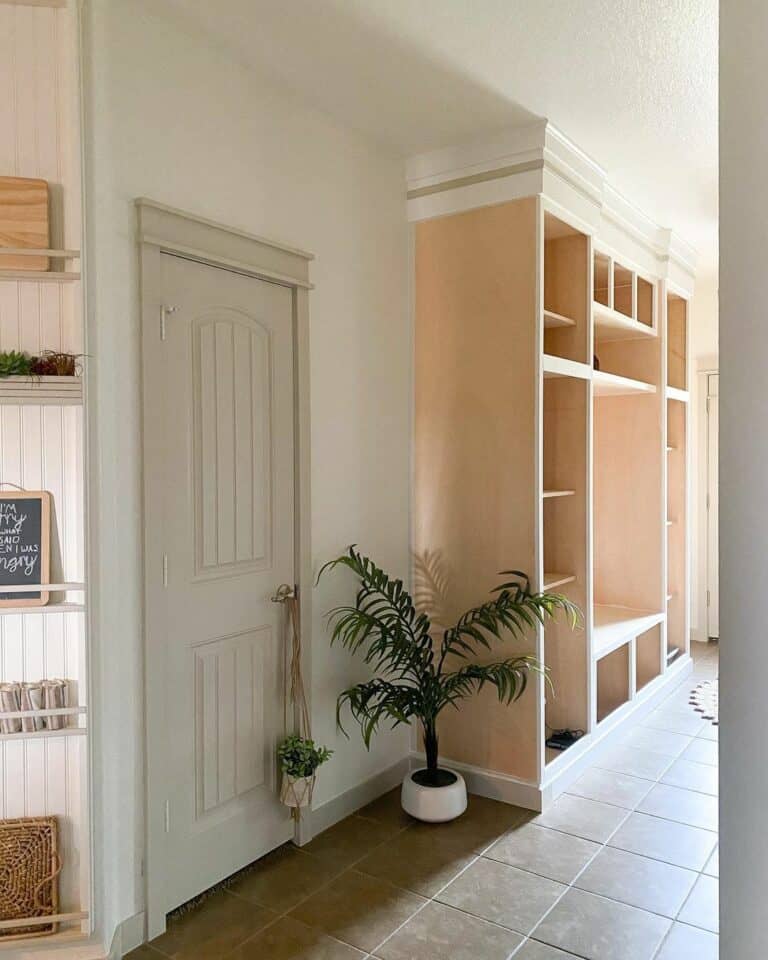 Hallway Storage With a Wooden Built-in Storage Area