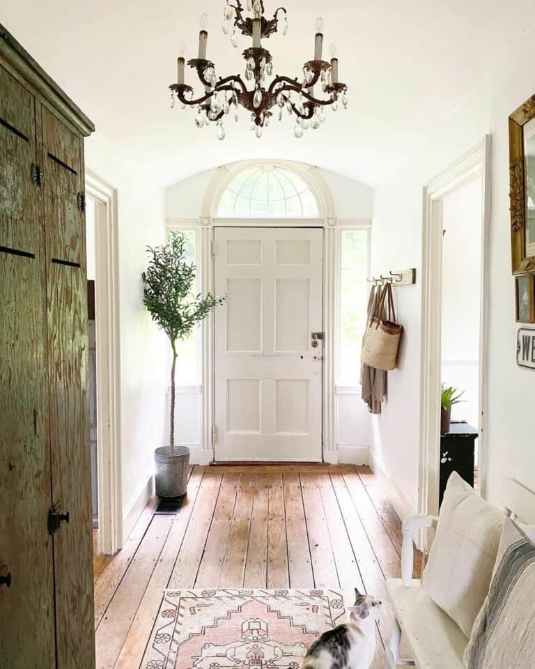 Hallway With Arched Entryway and Storage Area