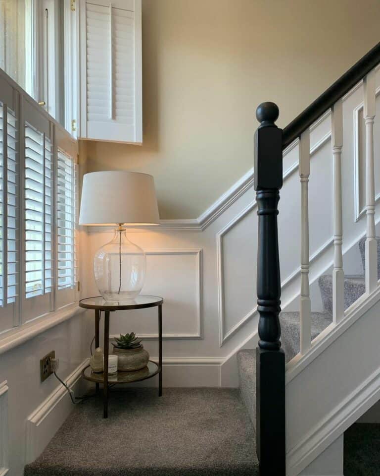 Illuminated Staircase with White Wainscoting