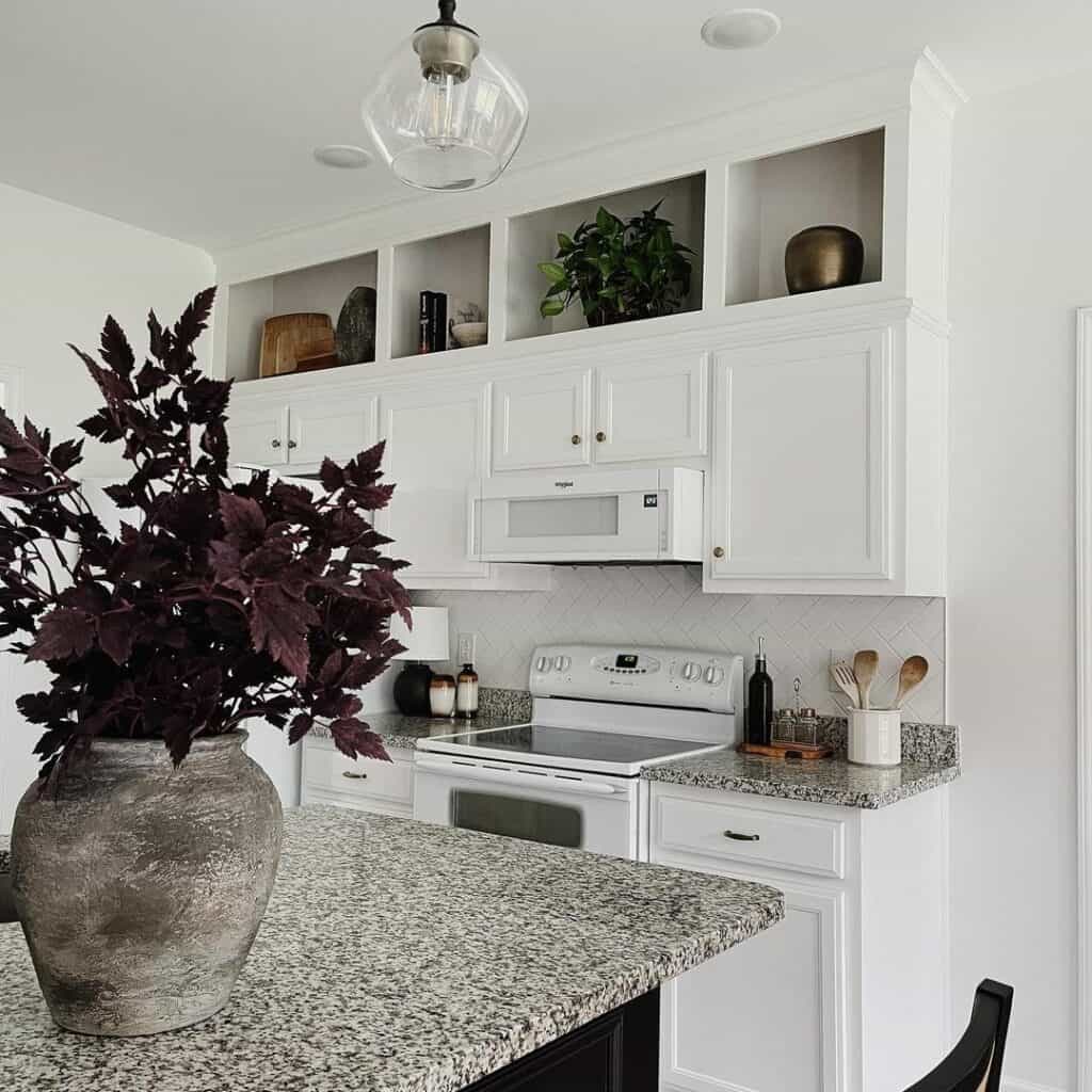 Kitchen Island With Purple Flowers in Gray Vase