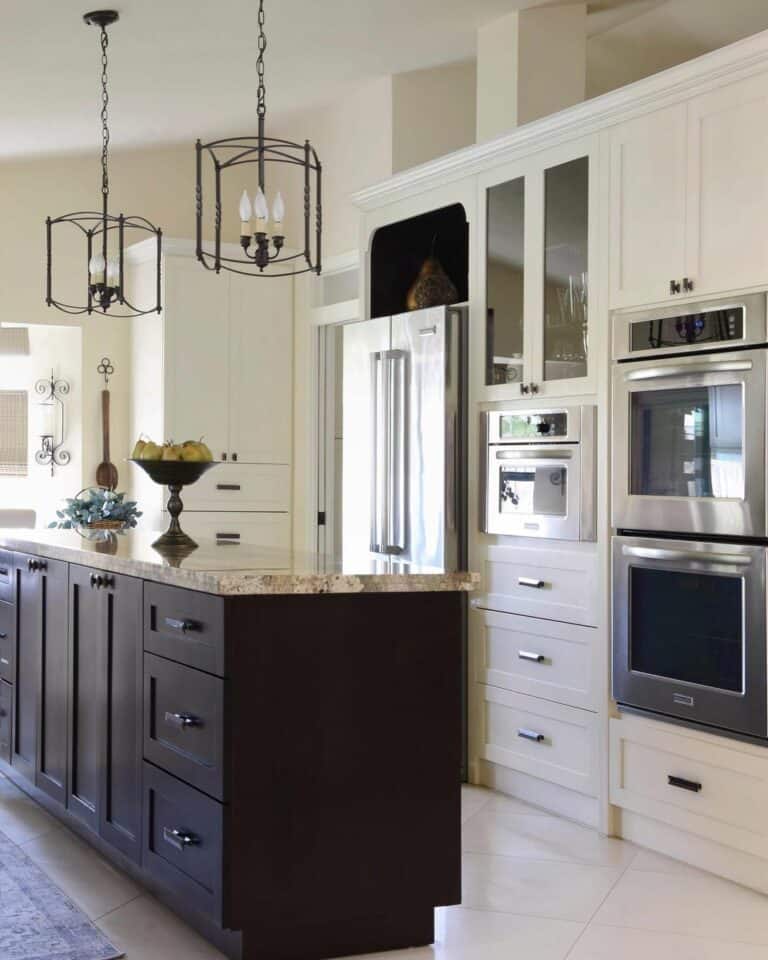 Kitchen Island With a Brown Granite Countertop