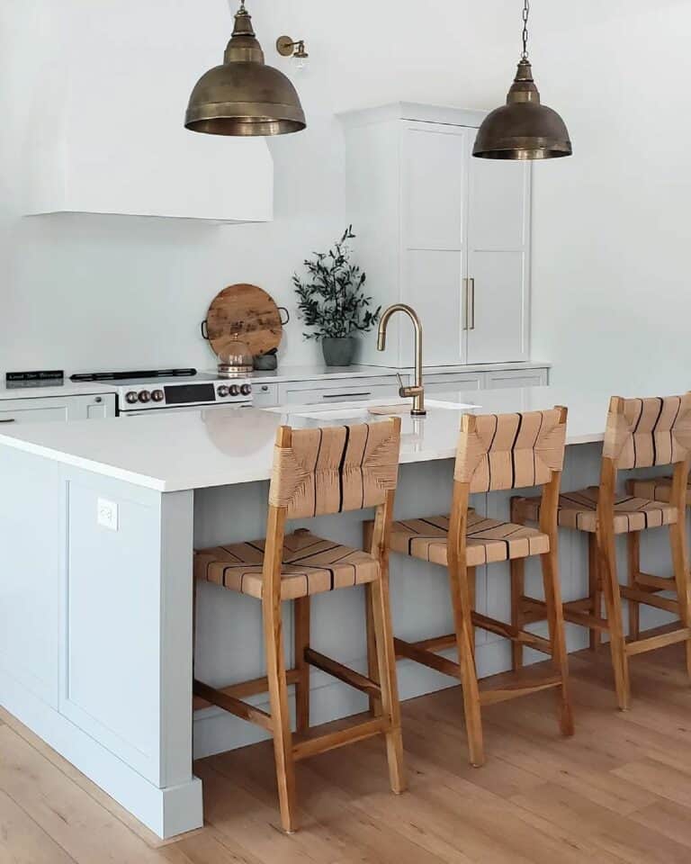 Kitchen With Marble Countertop and Patterned Wooden Chairs Soul & Lane
