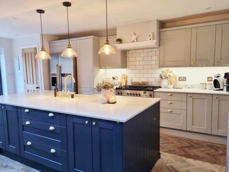 Kitchen With Navy Blue Island and Taupe Cabinetry