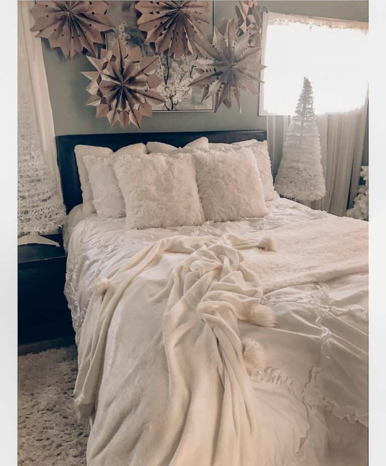 Large Paper Snowflakes and Rumpled White Bedding