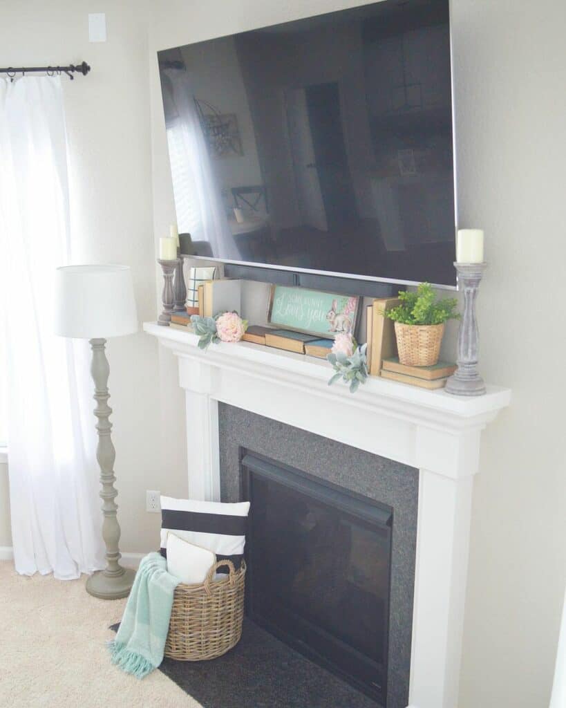 Large TV Over a White Fireplace