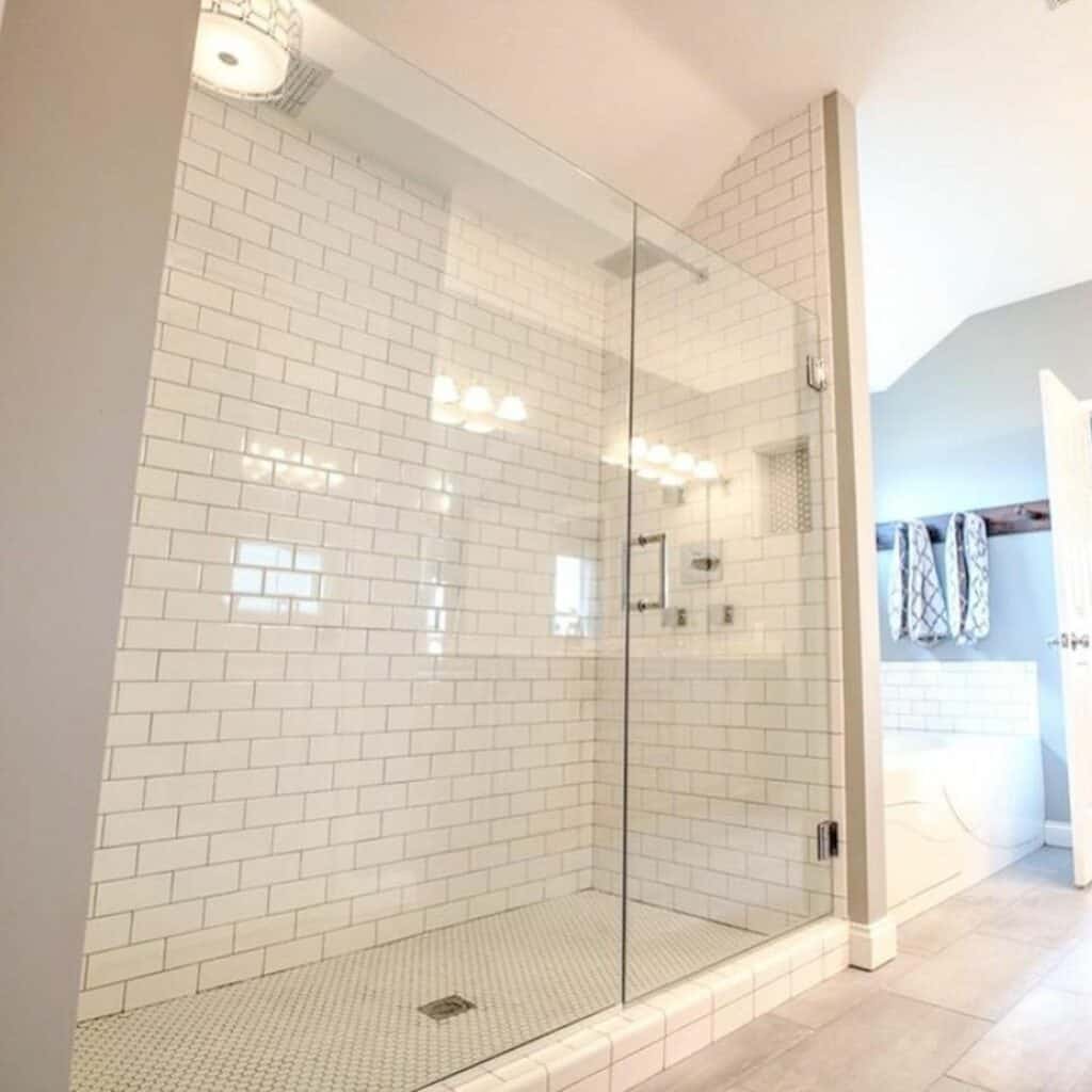 Large White Subway Tile Shower With Decorative Lighting