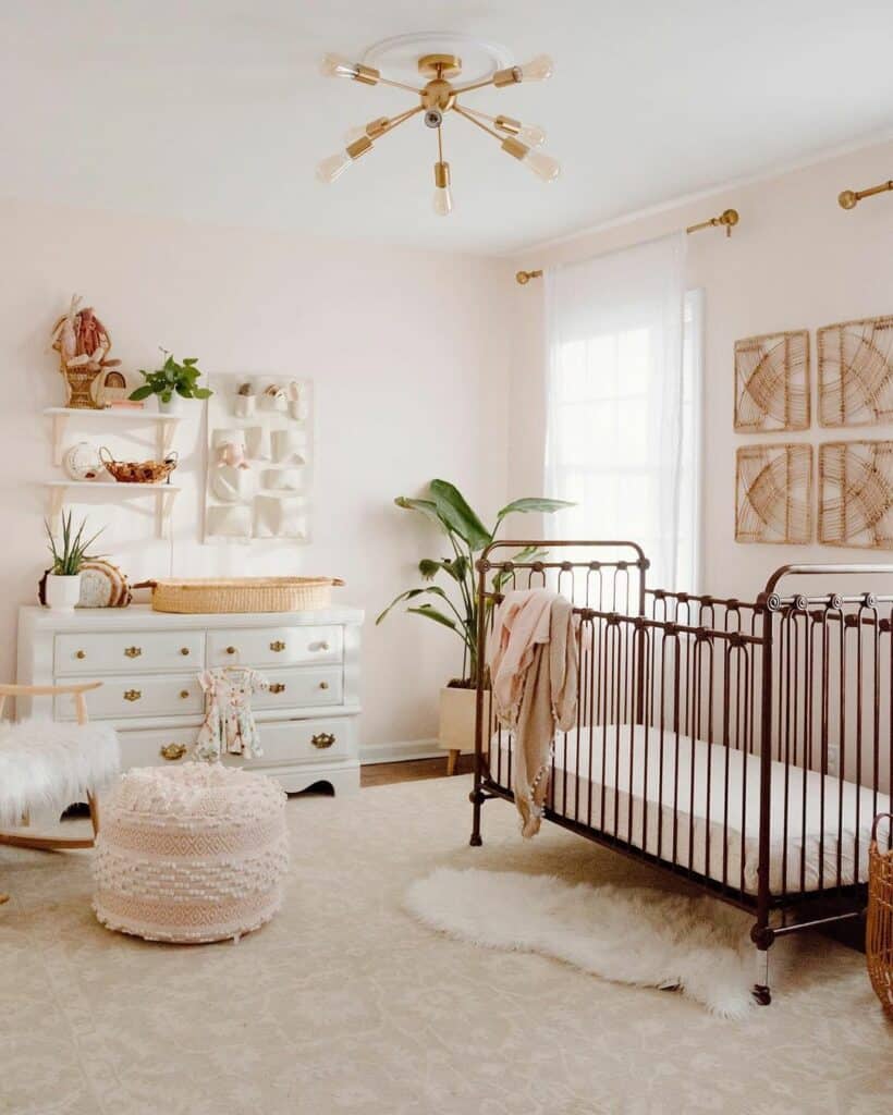 Light Pink Nursery With Rattan Décor