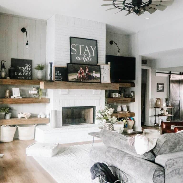 Living Room With Stained Wood Floating Shelves