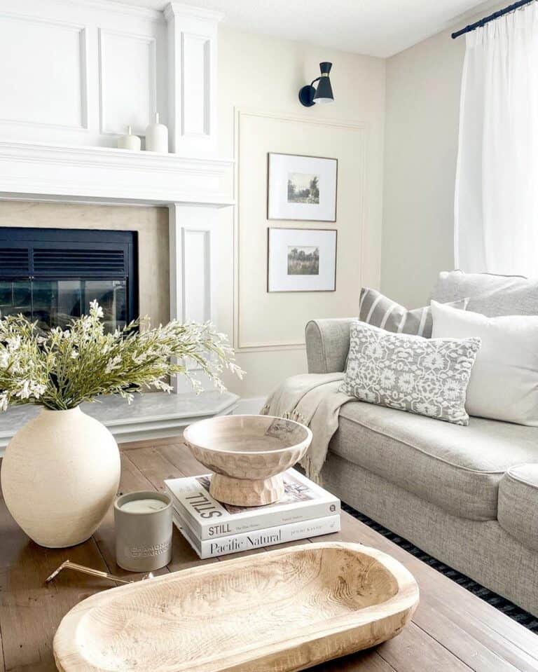 Living Room With White Fireplace and Beige Walls