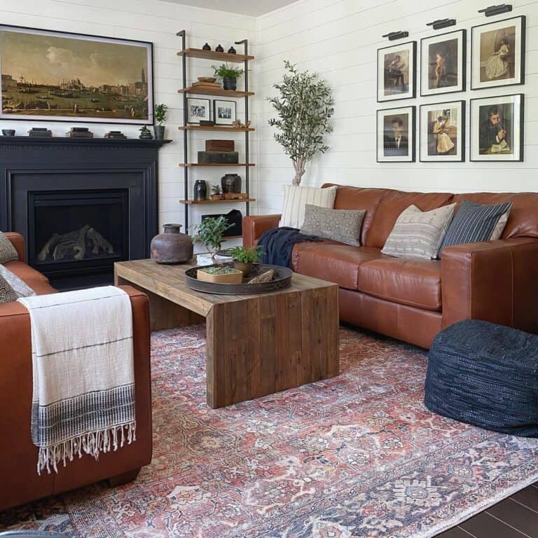 Living Room with Black Fireplace and Brown Leather Couches