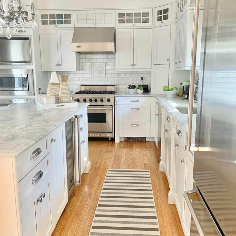 Marble Counters and White Kitchen Backsplash