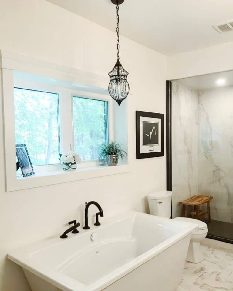 Marble Shower With Glass Paneled Doors
