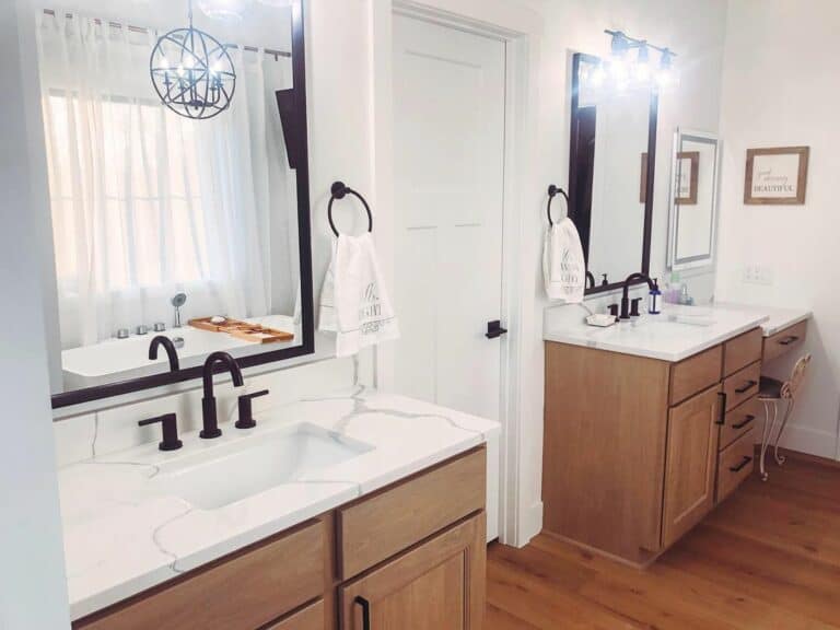 Master Bathroom With Double Wooden Vanity Sinks