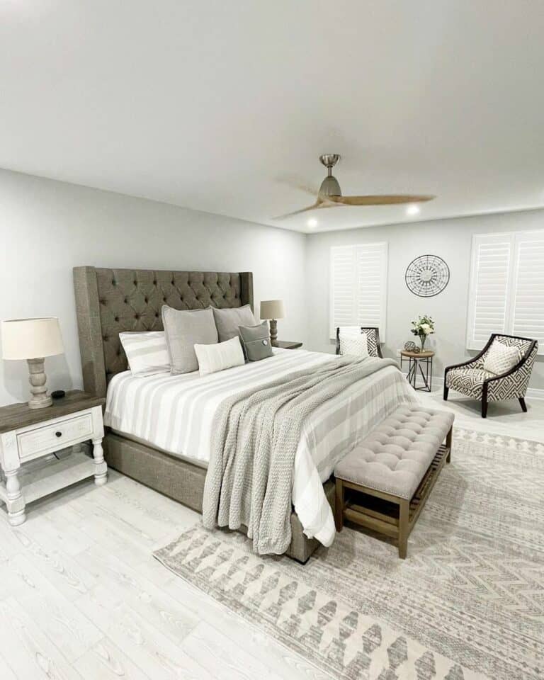 Master Bedroom With Armchairs and End Table
