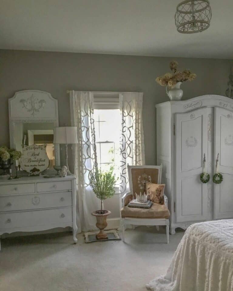 Master Bedroom With Tan and White Chair