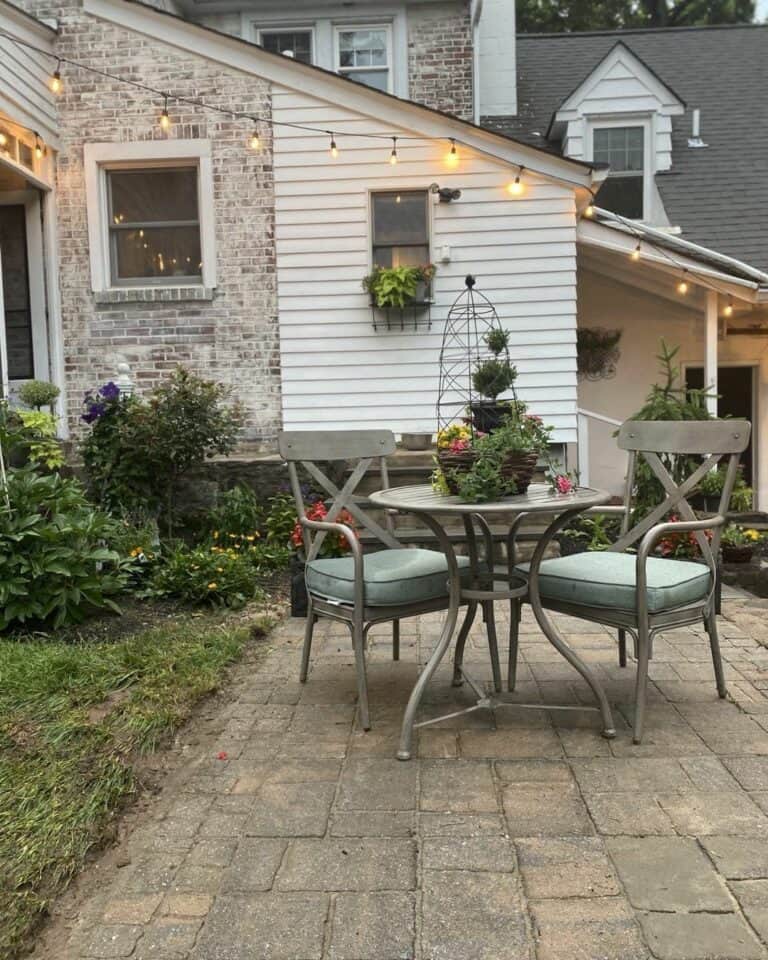 Mini Patio Design With Small Round Vintage Table