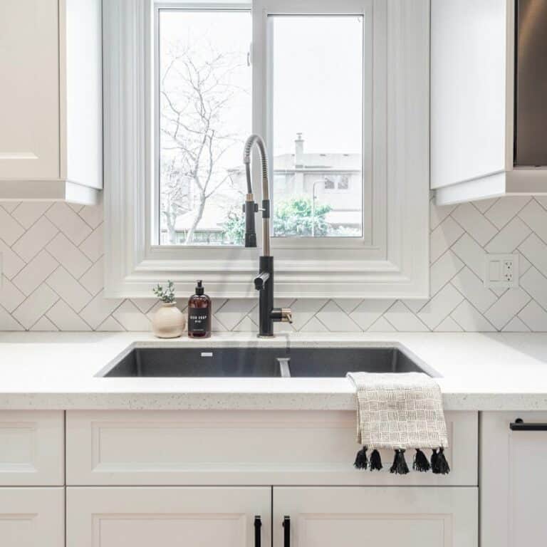 Minimalist White Kitchen With Herringbone Tile Backsplash