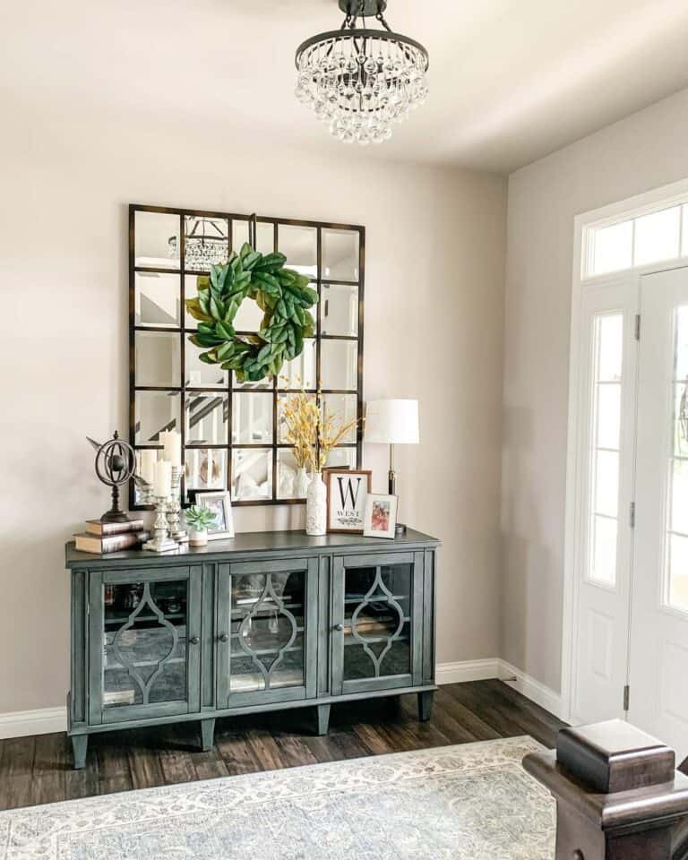 Modern Mirror Over Teal Credenza