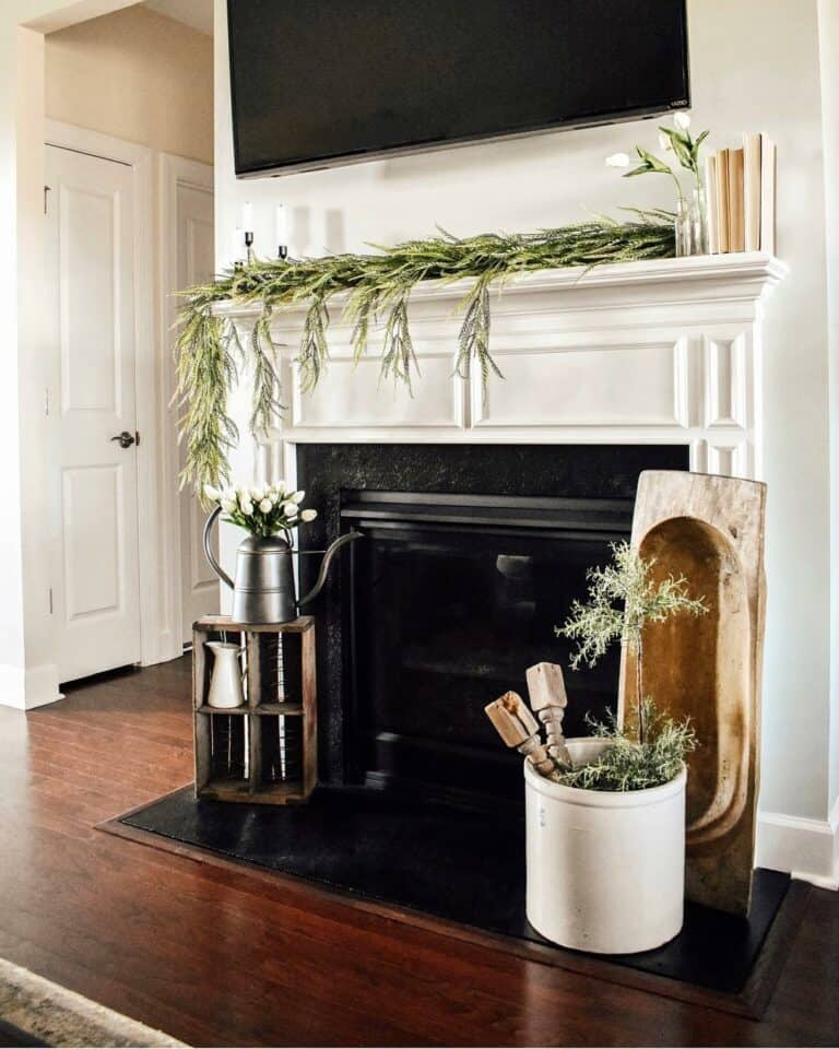 Modern White-and-Black Brick Fireplace With Greenery