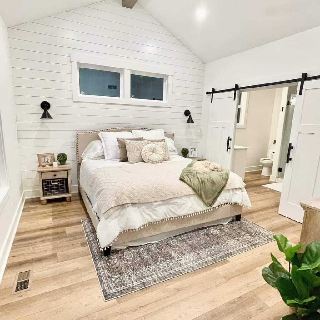 Neutral Bedding and Shiplap Accent Wall