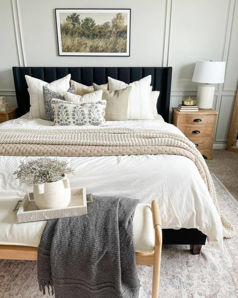 Neutral Green-toned Bedroom With Black Headboard