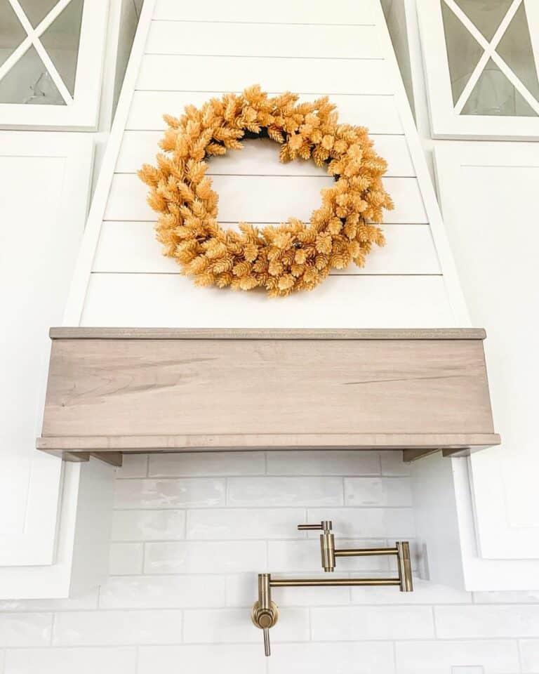 Orange Autumn Wreath on a White Shiplap Vent Hood Soul & Lane