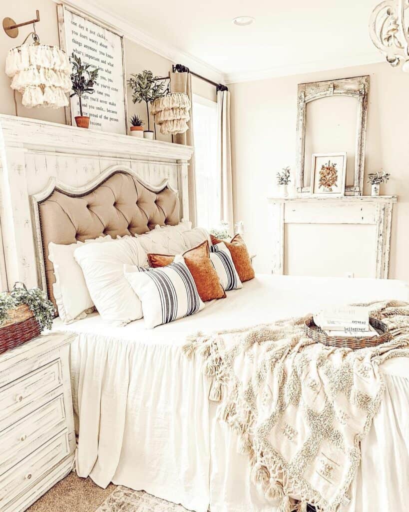 Orange and White Pillows on Farmhouse Bed