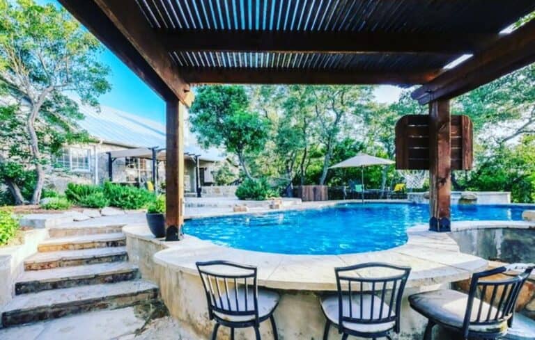 Outdoor Swimming Pool With Wooden Pergola