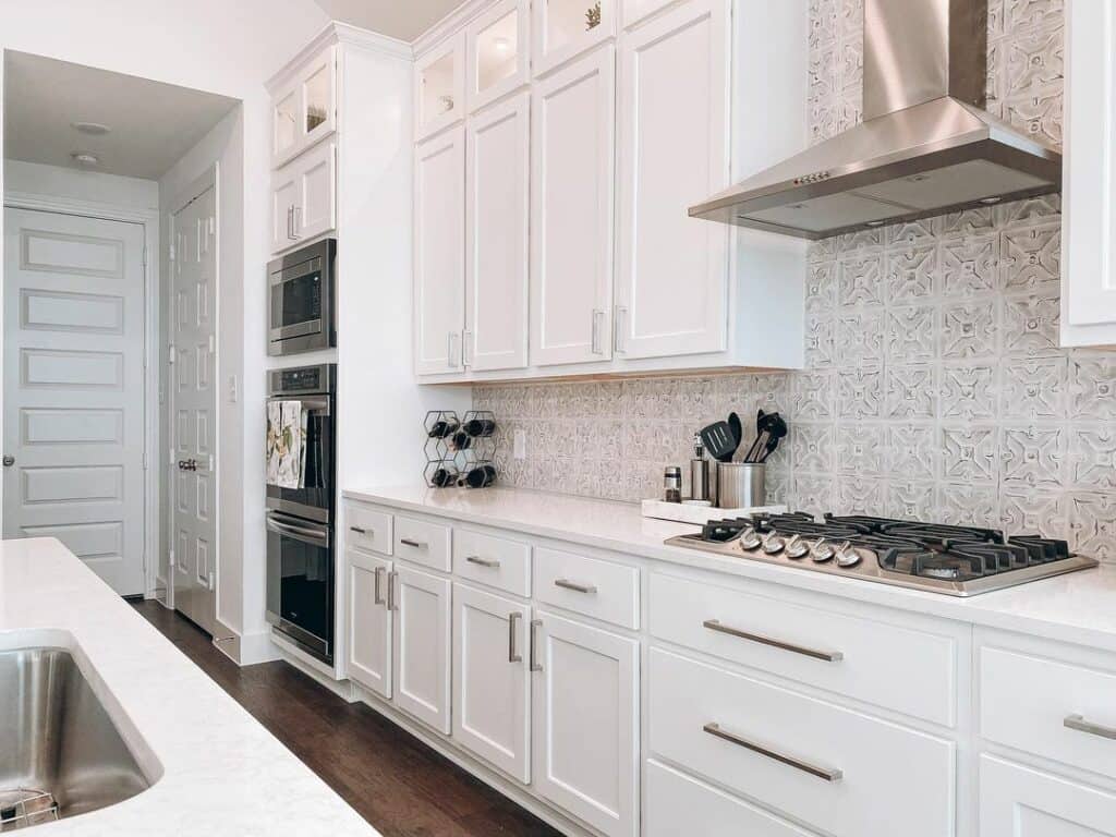 Painted Tin Backsplash Tiles in White Kitchen