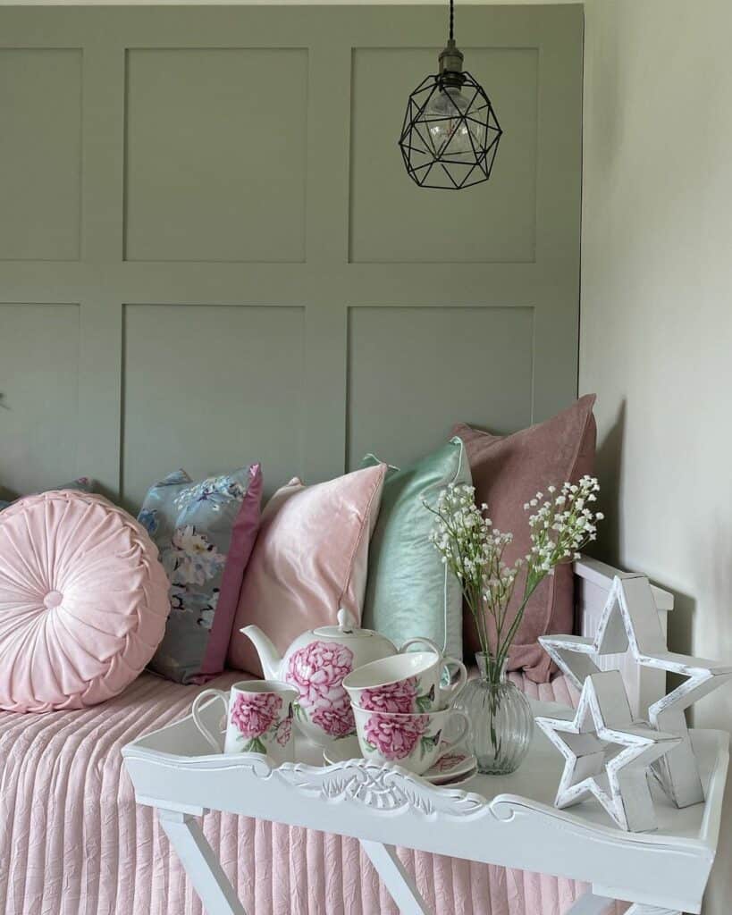 Pale Green Bedroom With Pink Bedsheets
