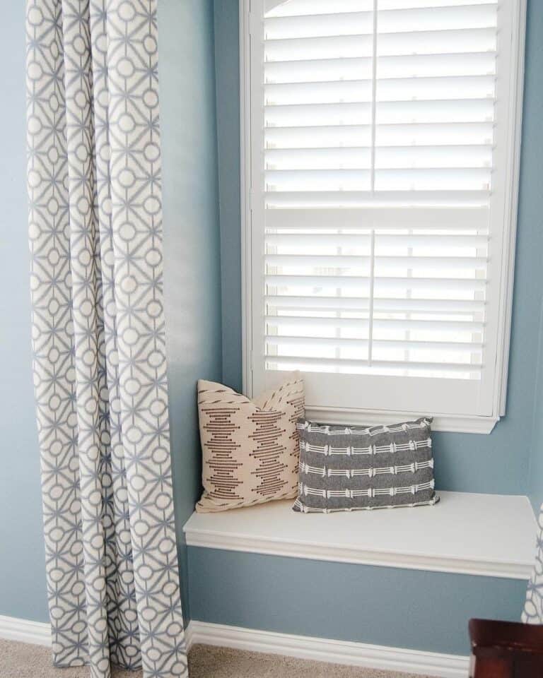 Patterned Curtain Over Light Blue Walls
