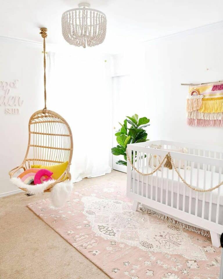 Pink Boho Nursery With Rainbow Décor