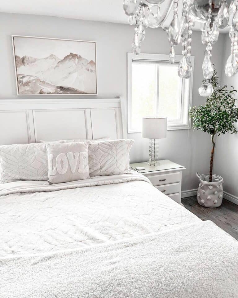 Pristine White Bedroom With Olive Tree