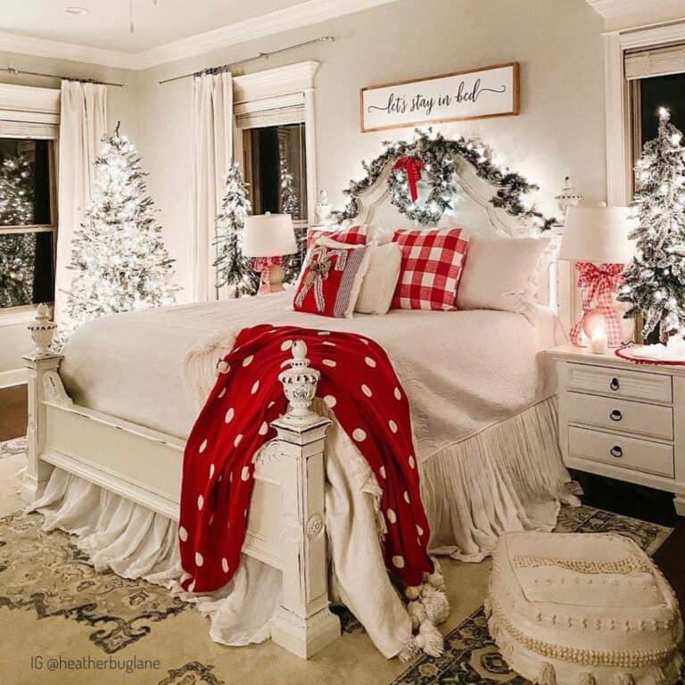 Red Accents and Evergreen Trees in a Festive Bedroom