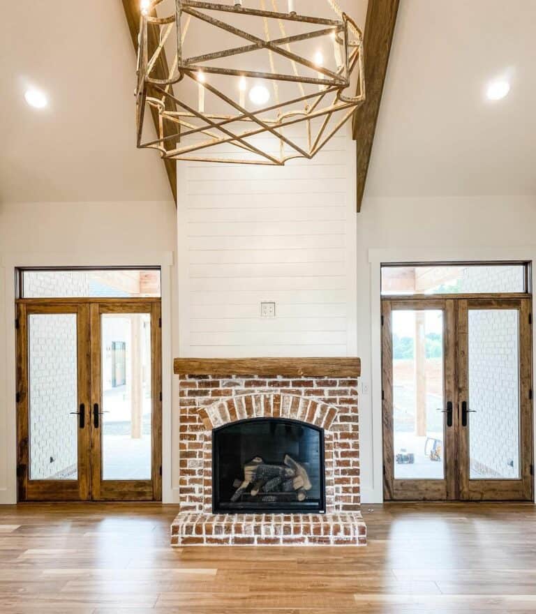 Red Brick Fireplace in Living Room With Wood Accents