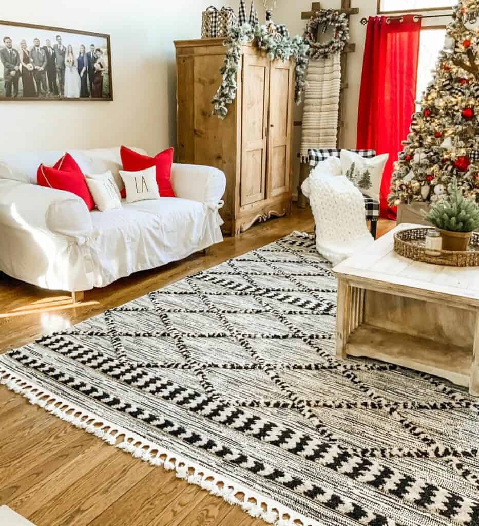 Rustic Farmhouse Living Room With Red Embellishments