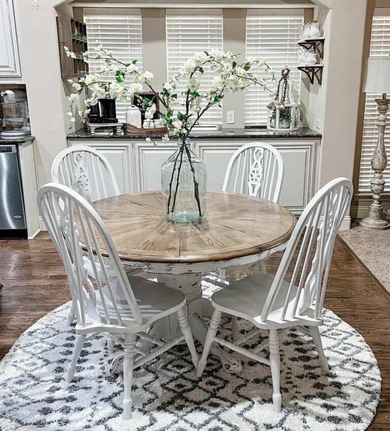 Rustic Pedestal Table With White Windsor Chairs