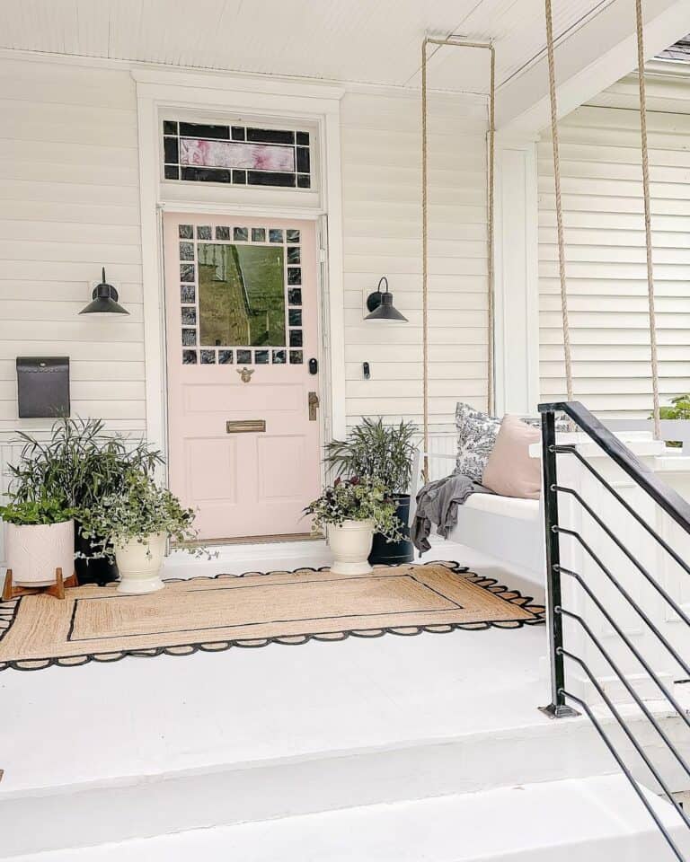 Sleek Linear Railing on White Farmhouse Porch