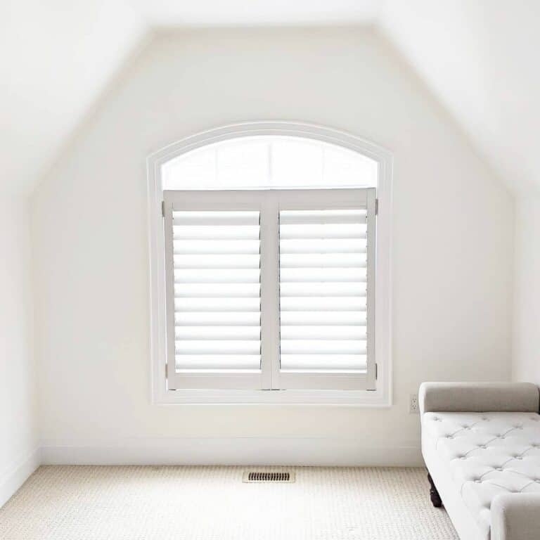 Small Arched Window With Interior Shutters