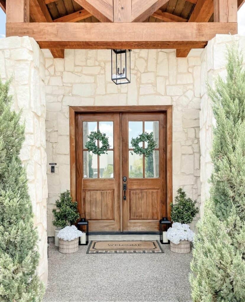 Small Covered Porch With Simple Floral Décor