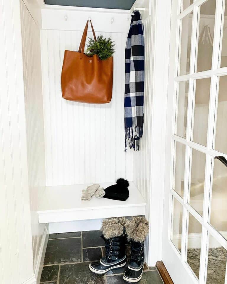 Small Entry Mudroom With White Floating Bench