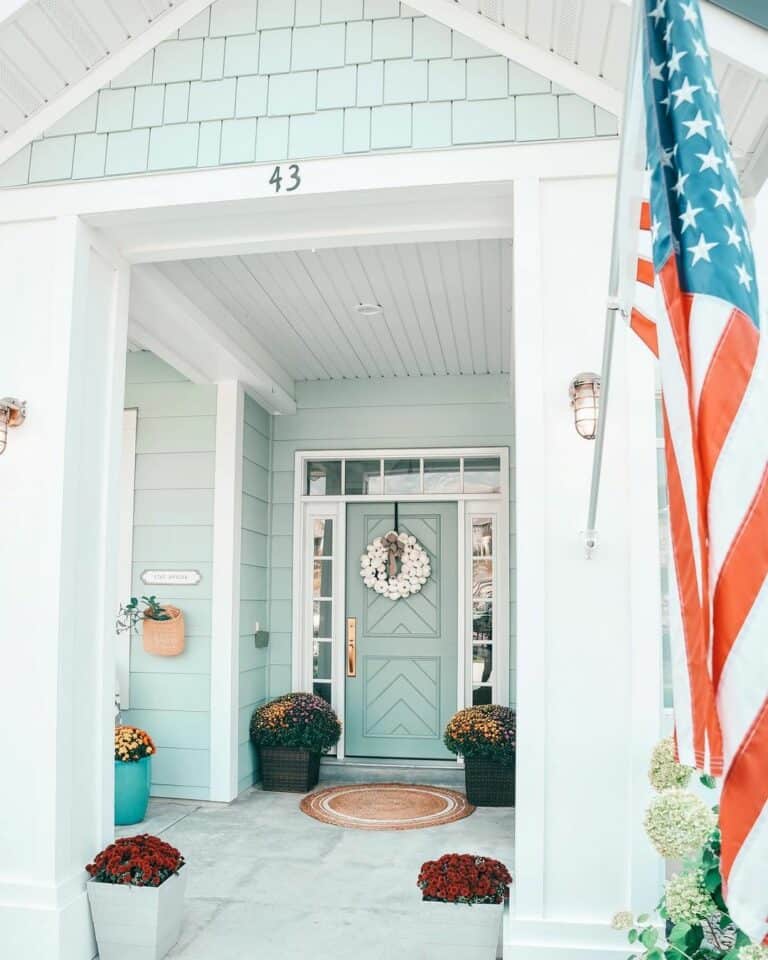 Small Porch Display With Bright Paint and Florals