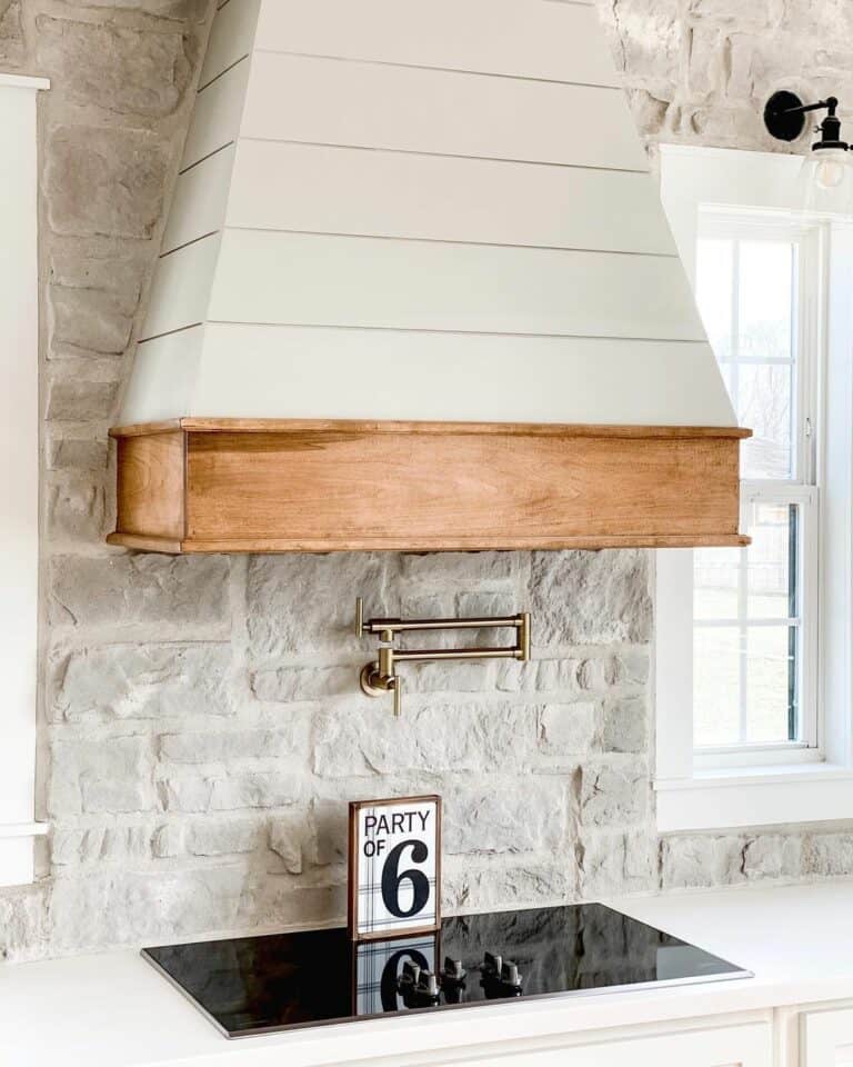 Stone Wall With a White Shiplap Hood