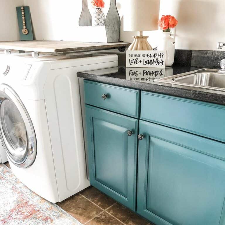Teal Laundry Room Cabinets With Black Countertop